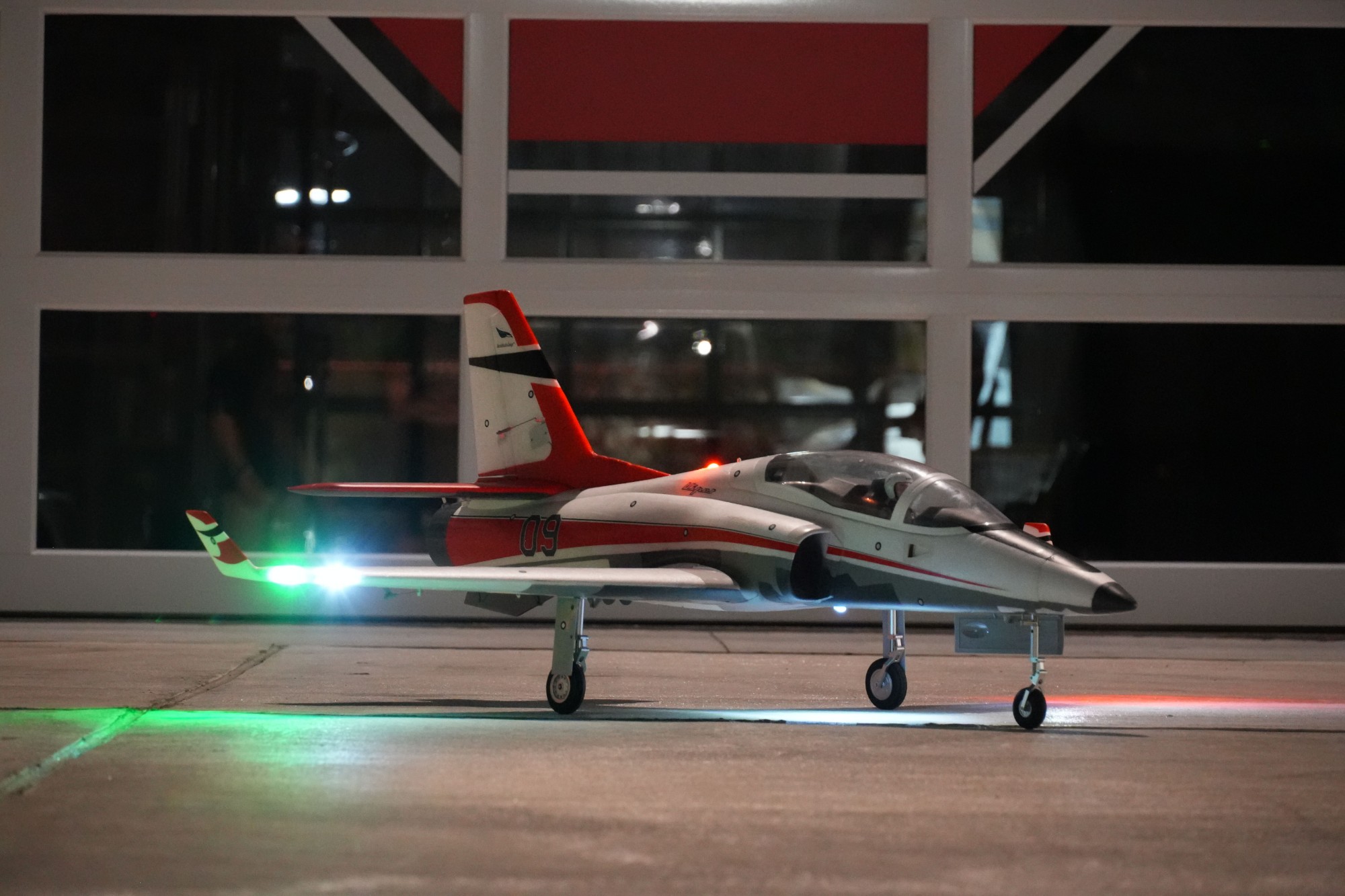 BExA jet on the hangar apron at night